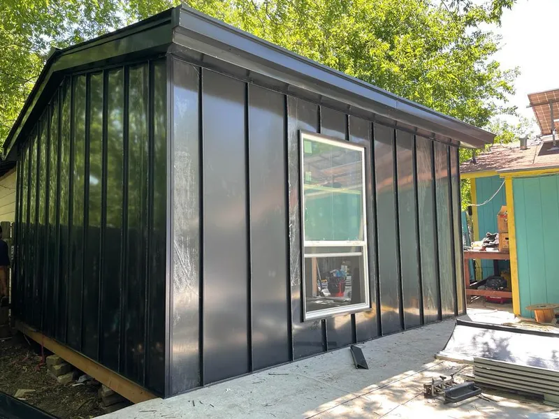 Black standing seam metal wall panels for Roof Inspection in Lone Grove